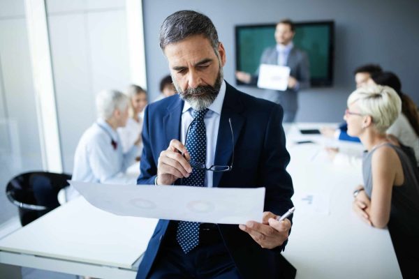 shot-of-thinking-financial-advisor-businessman-working-in-office.jpg